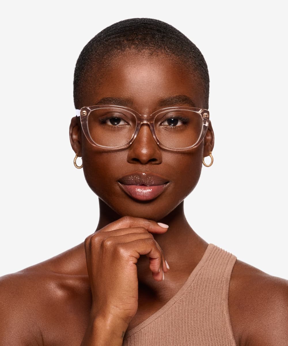 Woman trying on glasses using a tablet