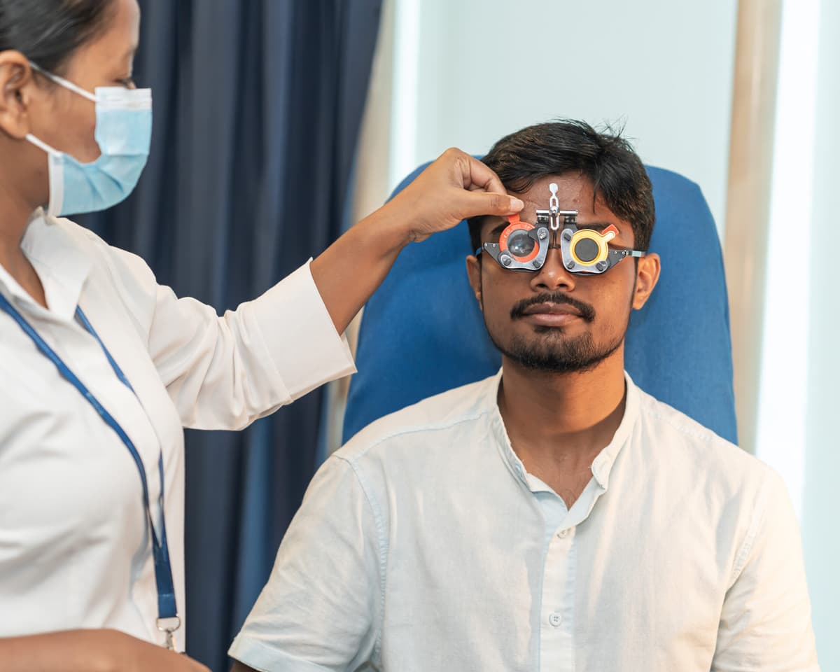 A friendly optician consulting with a patient