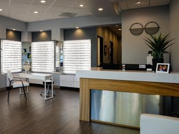 Friendly optician helping a customer
